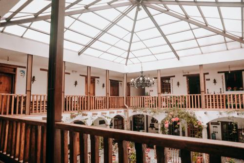 a view from the balcony of a building with a chandelier at Hotel Casa Alquimia in Quito