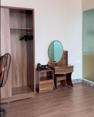 a bathroom with a dressing table and a mirror at Love House Homestay SAPA in Sa Pa
