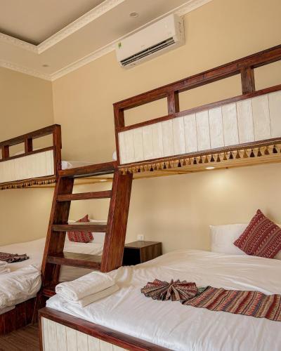 a bedroom with two bunk beds in a room at Love House Homestay SAPA in Sa Pa