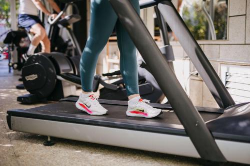 a woman is on a treadmill in a gym at Hotel Lalla Beauty & Relax in Cesenatico