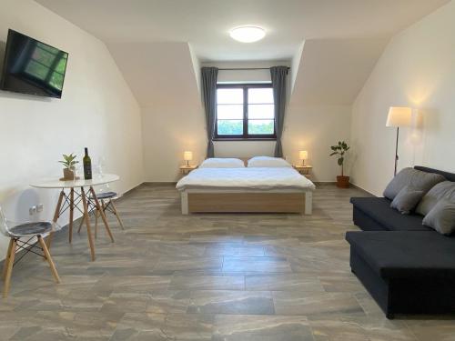Postel nebo postele na pokoji v ubytování Resort Konírna