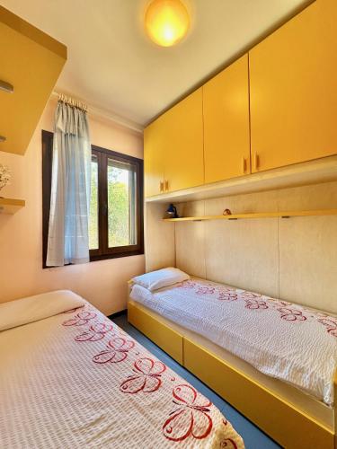 Postel nebo postele na pokoji v ubytování Arbatax Apartment by Jennas
