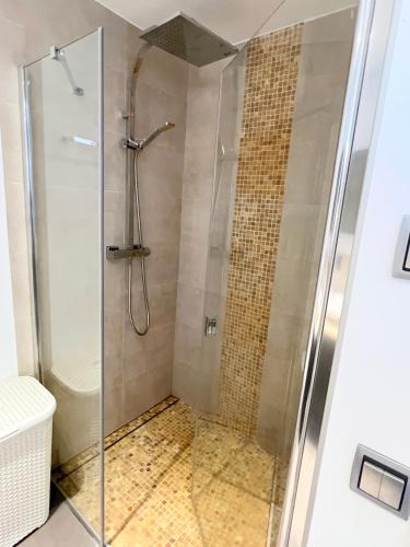 a shower with a glass door in a bathroom at Villa - Casa Ines in Cambrils
