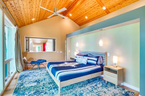 a bedroom with a bed and a wooden ceiling at Lakefront Roxboro Home with Private Dock! in Roxboro