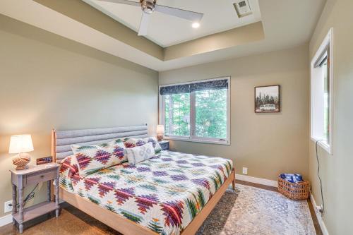 a bedroom with a bed and a window at Lakefront Roxboro Home with Private Dock! in Roxboro
