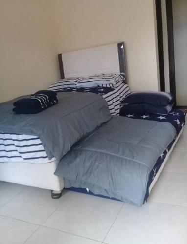 Кровать или кровати в номере Karjo Home Stay Syariah