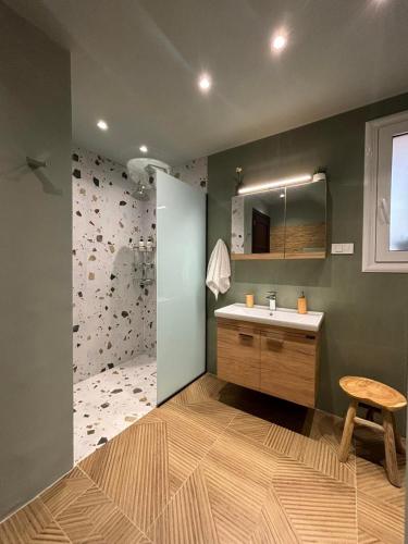 a bathroom with a sink and a mirror at Villa Fanouris in Chania