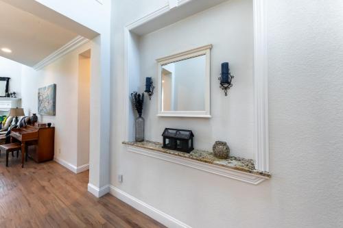 a hallway of a home with a window and a table at Family Home Near Lake & Local Parks in Little Elm
