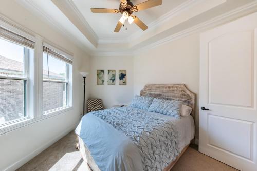a bedroom with a bed and a ceiling fan at Family Home Near Lake & Local Parks in Little Elm