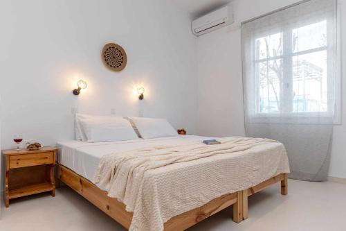 Posteľ alebo postele v izbe v ubytovaní Naxos Beachwalk Rooms