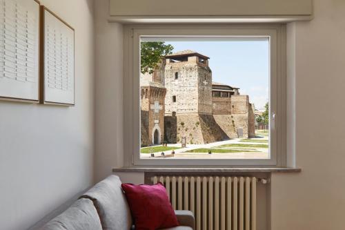 a window with a view of a castle at La Sismonda in Rimini