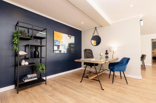 an office with a desk and a blue wall at MINT Hotel 84 on Katherine in Johannesburg