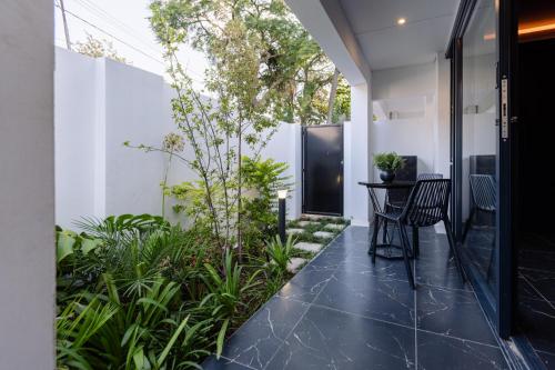 an internal courtyard of a house with plants at MINT Hotel 84 on Katherine in Johannesburg