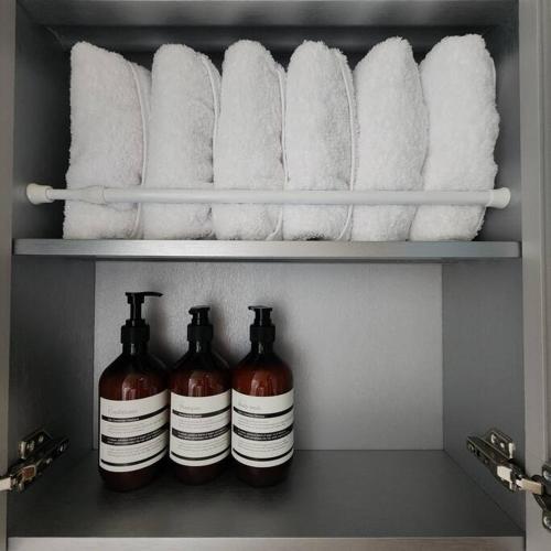 a shelf with rolls of toilet paper in a refrigerator at Dream Attic Seoul in Seoul