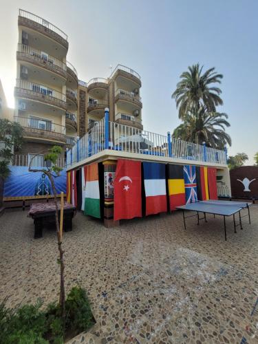 a playground in front of a building with a play structure at Blue Nile House in Luxor