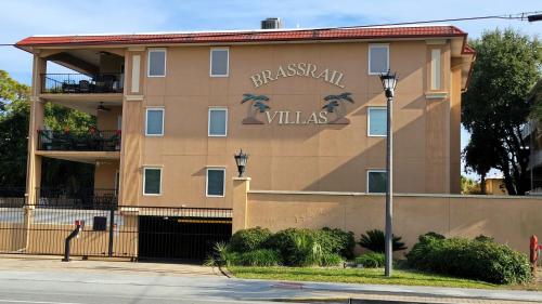 a building with a sign for a villas at Brass Rail Villas 109 by Tybee Vacation Rentals in Tybee Island
