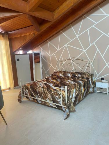 a bedroom with a metal bed in a room at Vesux Apartments in Naples