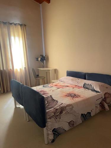 a bedroom with a bed with a blanket on it at Vesux Apartments in Naples
