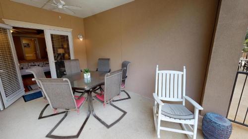 a dining room with a table and chairs at Brass Rail Villas 109 by Tybee Vacation Rentals in Tybee Island