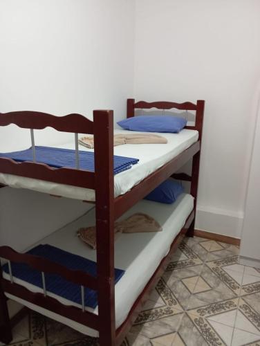 a pair of bunk beds in a room at Tamboleiros Hotel & Hostel in Salvador
