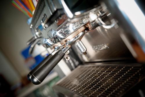 a close up of a kitchen sink with a laptop computer at Casa Hellen in Monteforte dʼAlpone