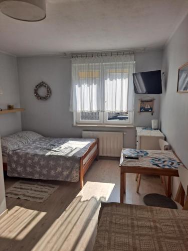 Кровать или кровати в номере Apartament Pokoje U Franka