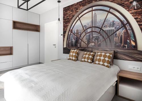 Posteľ alebo postele v izbe v ubytovaní Landmark Apartments