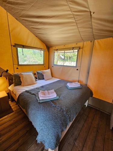 a bedroom with a bed in a tent at Casa Boavista in São Martinho do Porto