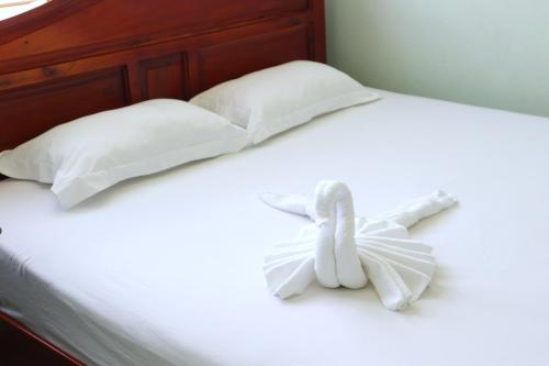 Katil atau katil-katil dalam bilik di Quoc Dinh Guest House