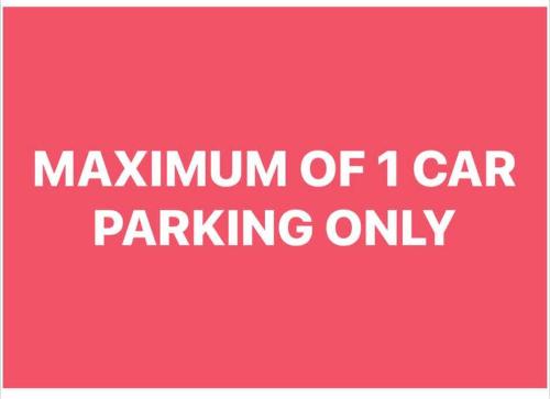 a pink sign with the wordsmaximum of car parking only at 7pax, 2 AC BR,Videoke,Games,Netflix,Cook,Parking in Rodriguez