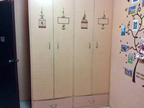 a row of wardrobes with bird cages on them at 7pax, 2 AC BR,Videoke,Games,Netflix,Cook,Parking in Rodriguez