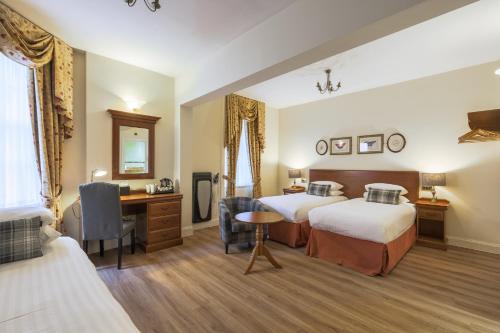 Ένα ή περισσότερα κρεβάτια σε δωμάτιο στο Old Waverley Hotel