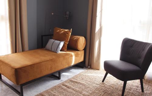 Ruang duduk di Apartamentos NONO by Charming Stay