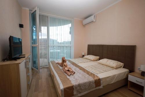 Ένα ή περισσότερα κρεβάτια σε δωμάτιο στο Sunset Apartment Atlantis Resort