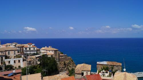 a group of buildings on a hill next to the ocean at B&B Il Vicolo Di Pizzo in Pizzo