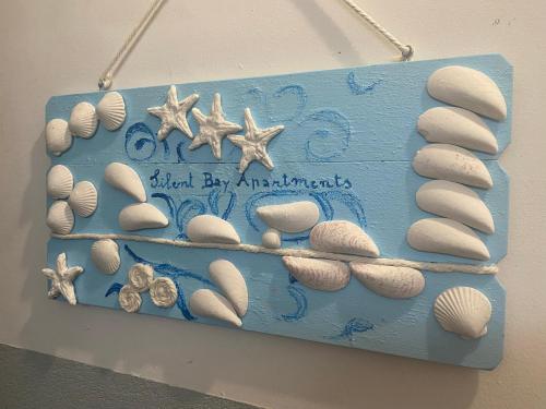 a blue cake with seashells and stars on it at Silent Bay Apartments in Sestri Levante