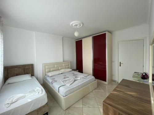 Ένα ή περισσότερα κρεβάτια σε δωμάτιο στο Leo Apartament
