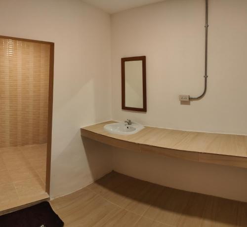a bathroom with a sink and a bath tub at PaiFamilyRESORT in Pai