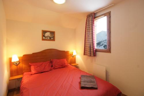 Voodi või voodid majutusasutuse Appart - Chalet du Hameau des Aiguilles toas