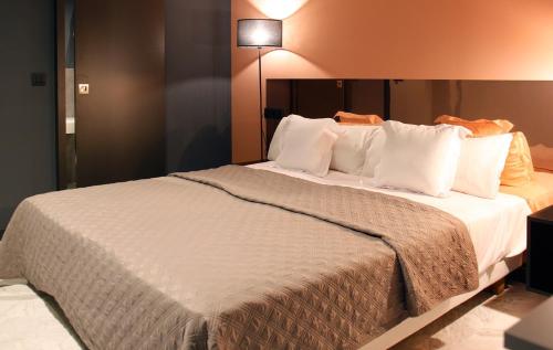 Katil atau katil-katil dalam bilik di Apartamentos NONO by Charming Stay