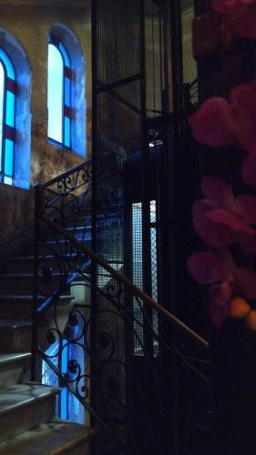 a staircase with blue lights in a building at B&B Amarantha Gothica Genoa in Genova