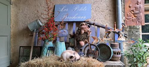 a stuffed animal sitting on top of a pile of hay at Le Mas du Lac in Uzès