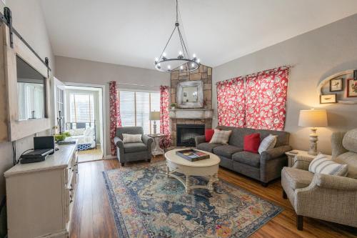 a living room with a couch and a table at 3BR with Loft - Near The Strip - FREE TICKETS INCLUDED - FW2-6 in Branson