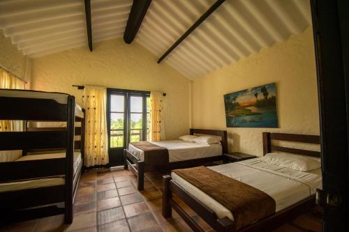 a bedroom with two beds and a window at Tiuma Park in Marsella