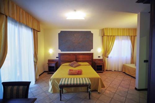 Ein Bett oder Betten in einem Zimmer der Unterkunft Al Brunello