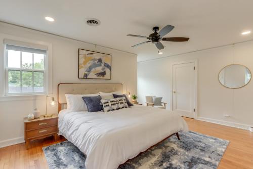 a bedroom with a bed and a ceiling fan at Fayetteville Home about 2 Blocks to Dickson Street! in Fayetteville