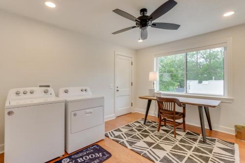 a kitchen with a ceiling fan and a table at Fayetteville Home about 2 Blocks to Dickson Street! in Fayetteville