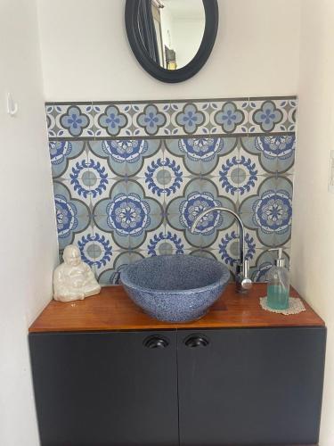 a bathroom counter with a sink and a mirror at El Descanso Casa de retiro in Tandil