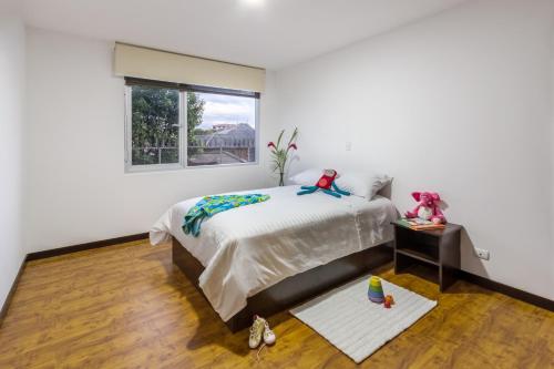 Кровать или кровати в номере Gaviota Apartments & Suites