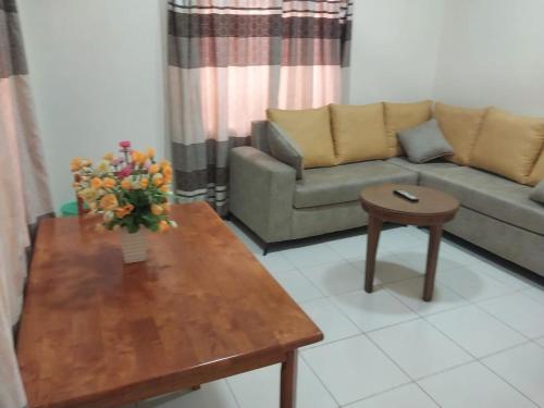 a living room with a couch and a table at Tulba Hotel and Residences in Juba